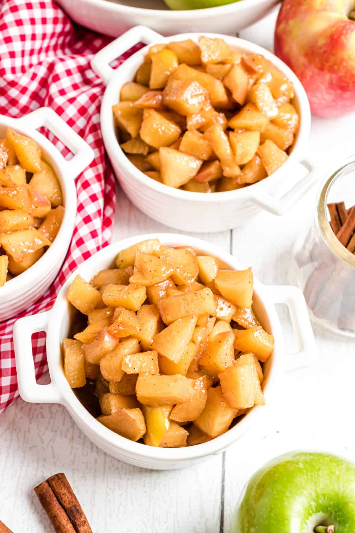 Fried apples served in small white bowls.