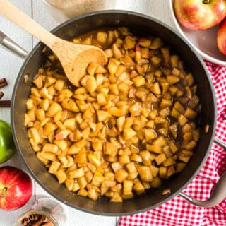 Cinnamon fried apples in large skillet.