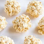 Popcorn balls on parchment paper.