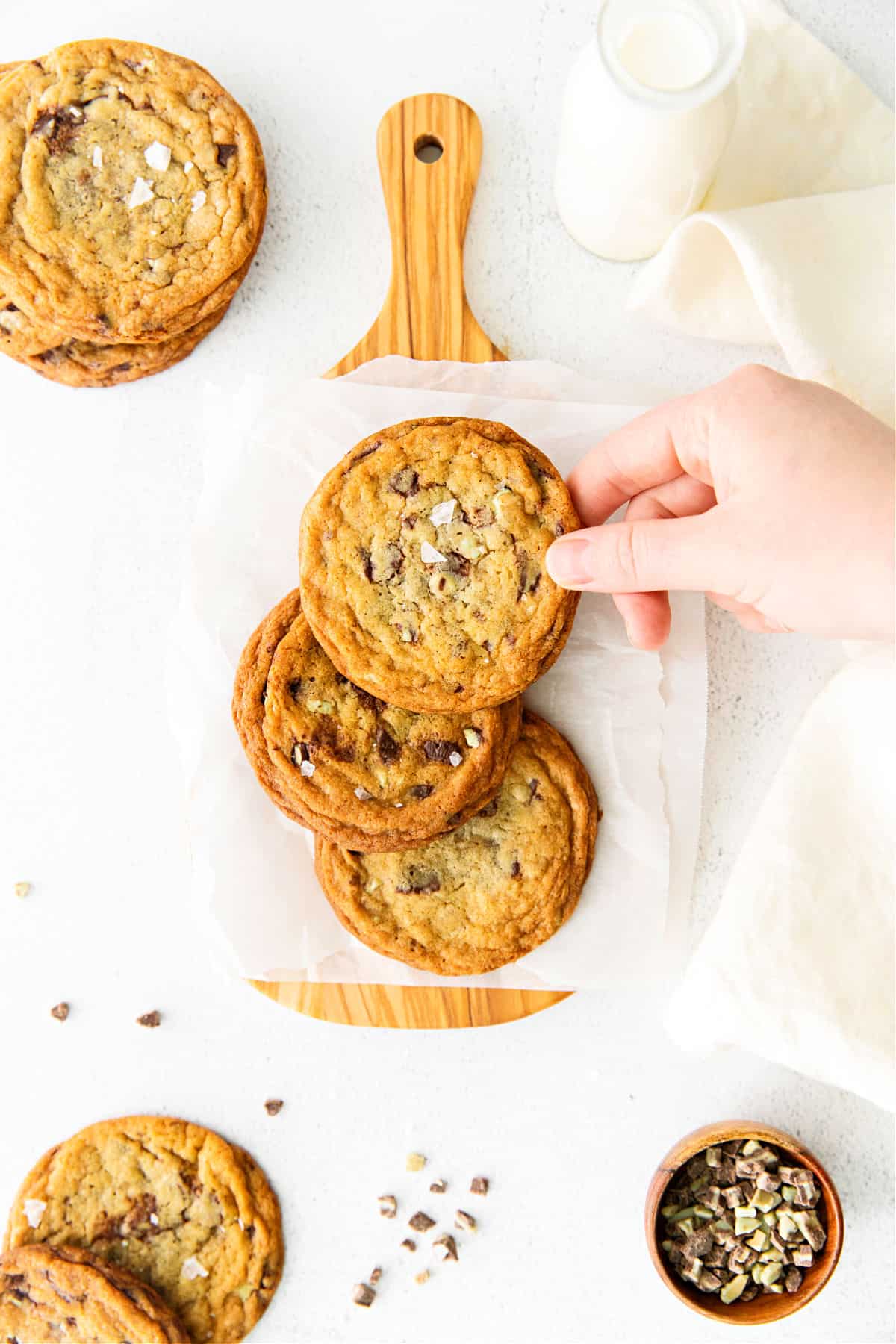 Large Andes mint cookies on a piece of parchement paper.