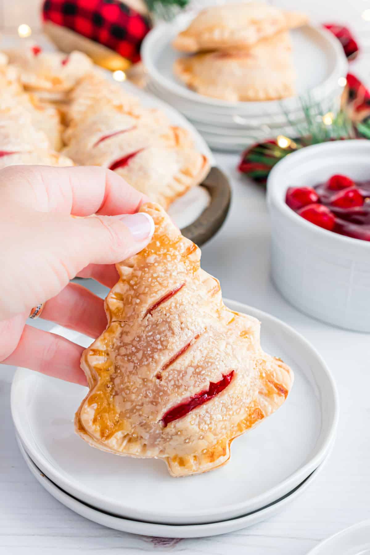 Cherry hand pie shaped like a Christmas tree.