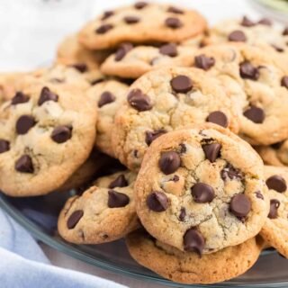 Stack of nestle toll house cookies on a serving plate.