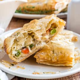 This Turkey Hand Pies recipe is a tasty and creative idea for using leftover turkey! Grab some puff pastry and make these savory hand pies to enjoy over the holiday weekend.