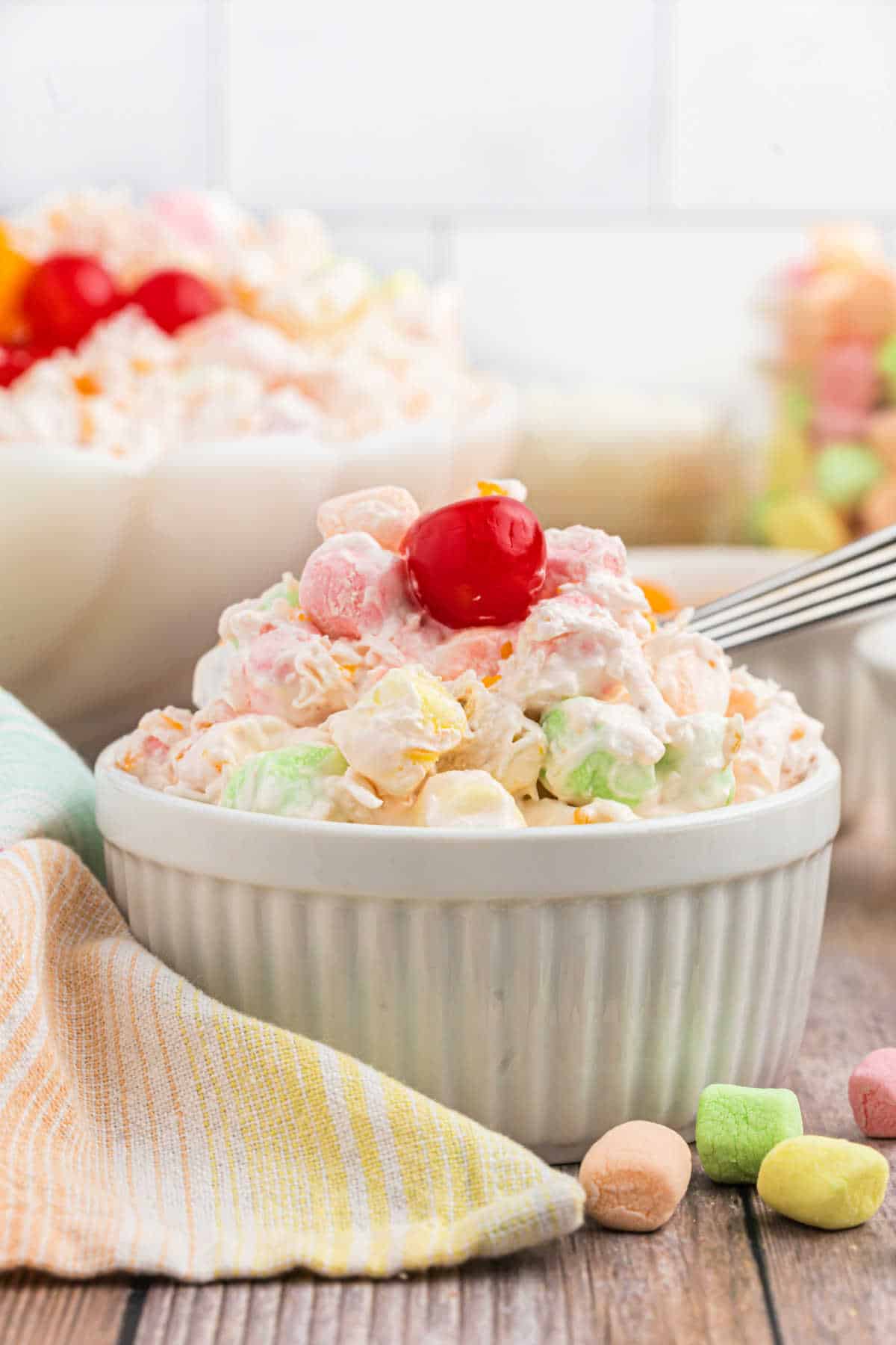 Ambrosia salad served in white ramekins.