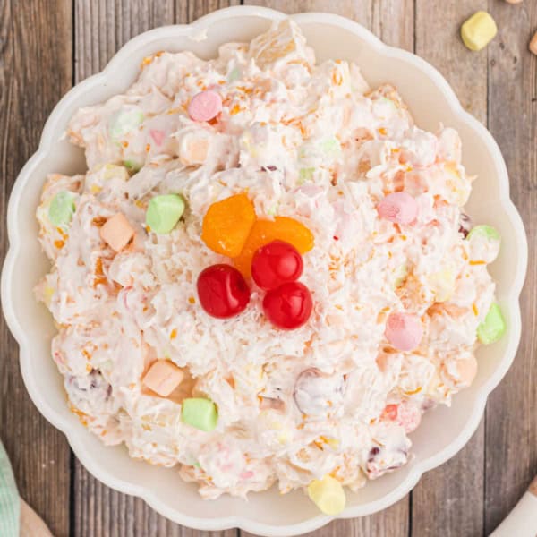 Bring extra sweetness to your holiday table with this Ambrosia Salad recipe! Toss canned fruit with whipped cream and marshmallows to create an easy an easy side dish.
