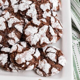Chocolate Crinkle Cookies have a fudgy soft-baked center surrounded by crackly edges. A dusting of powdered sugar makes them picture perfect for the holidays!