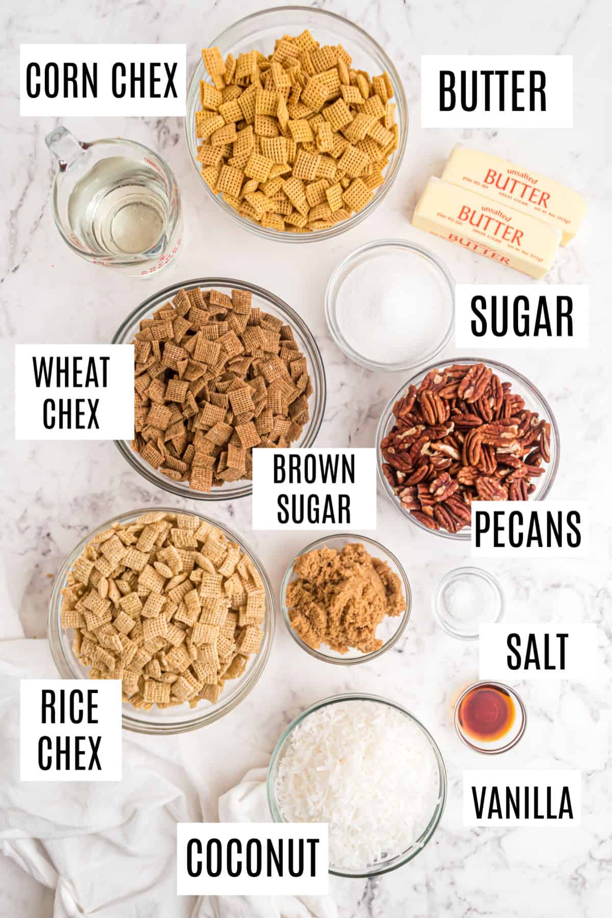 Ingredients needed to make sweet holiday chex mix.