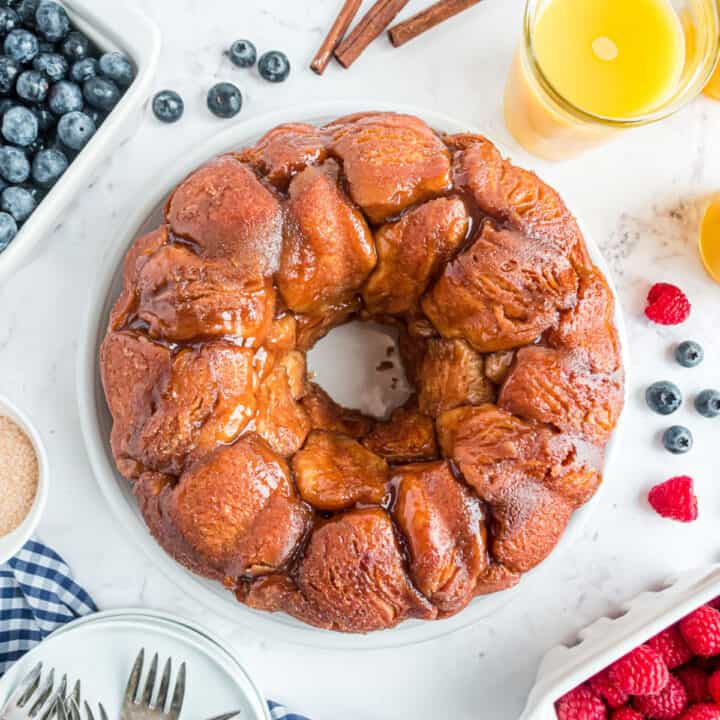 Monkey bread served with berries and orange juice.