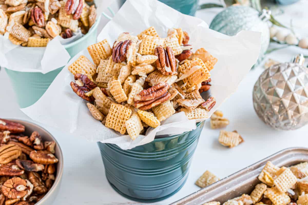 Sweet holiday chex mix in a little gift canister.
