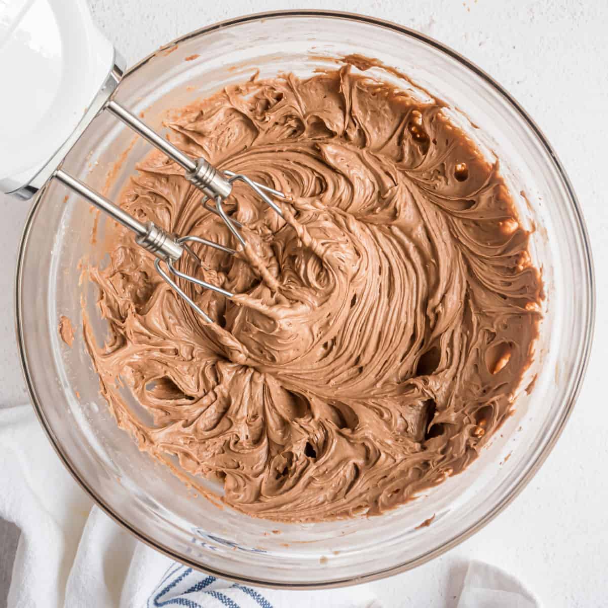 This Chocolate Cream Cheese Frosting is creamy, rich and easy to make. Spread it over sugar cookies or cupcakes for an extra layer of decadence!