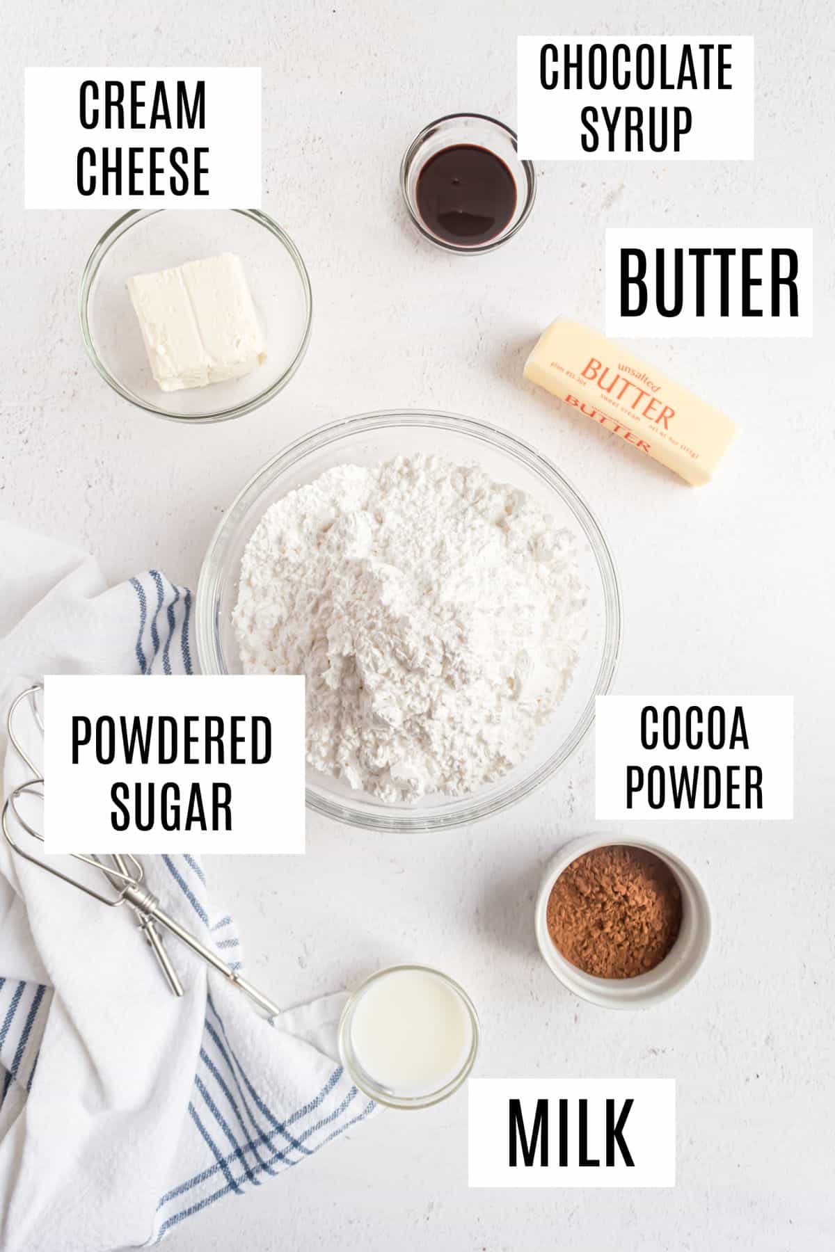 Ingredients needed to make chocolate cream cheese frosting.