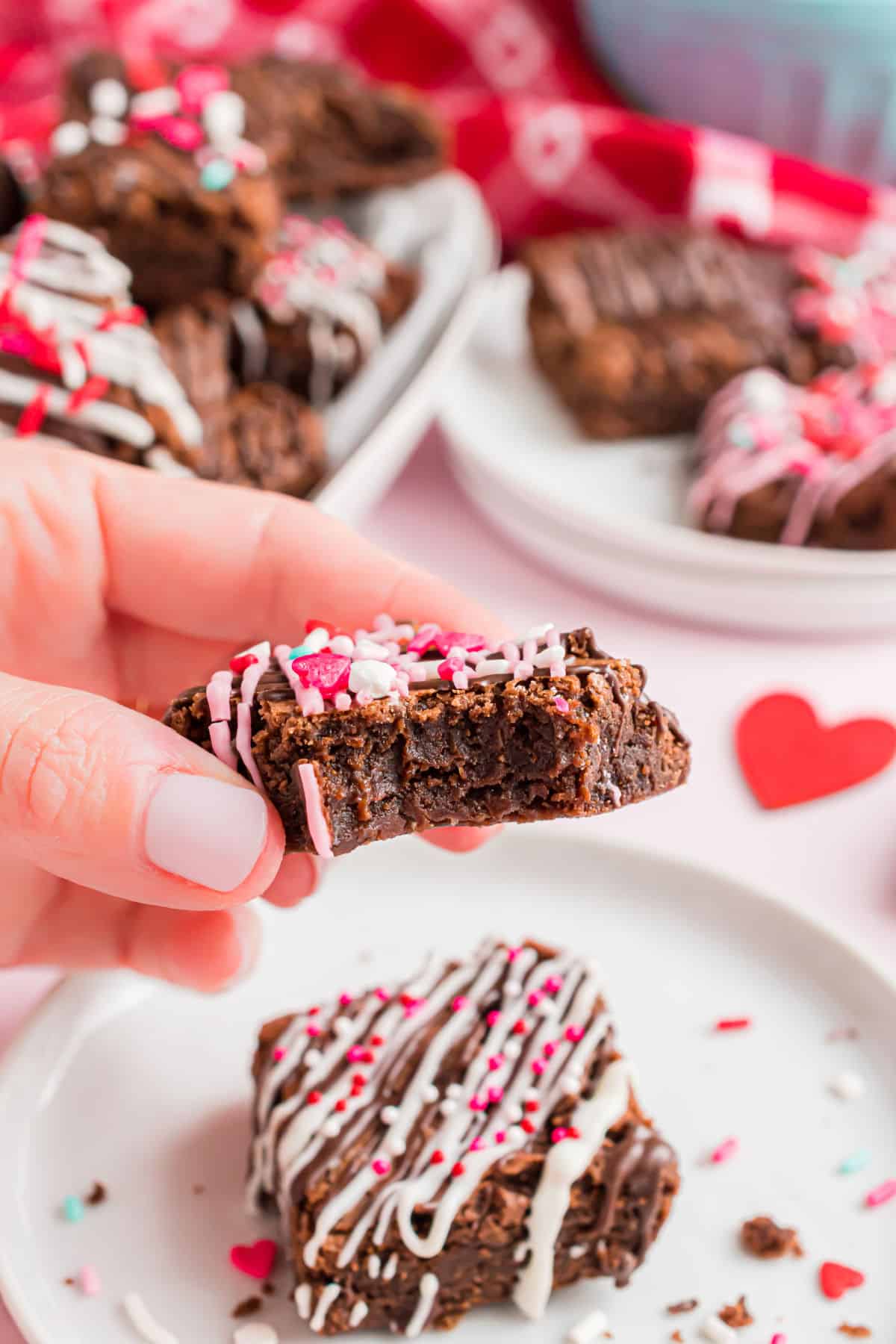 Decorated brownies with one bite removed.