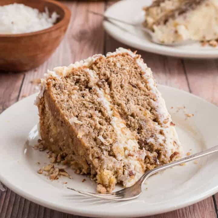 Hummingbird Cake is a moist layer cake filled with pineapple, pecans and coconut. Perfectly sweet and spiced with cinnamon, this classic southern dessert keeps everyone coming back for another slice!