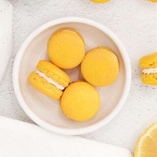 Indulge in these Lemon Macarons with lemon curd filling. Zesty lemon flavor meets sweet macarons in this elegant and cheerful cookie! I'll share tips and tricks to make this sweet magical macaron cookie.