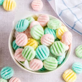 Pastel mints in a white bowl.