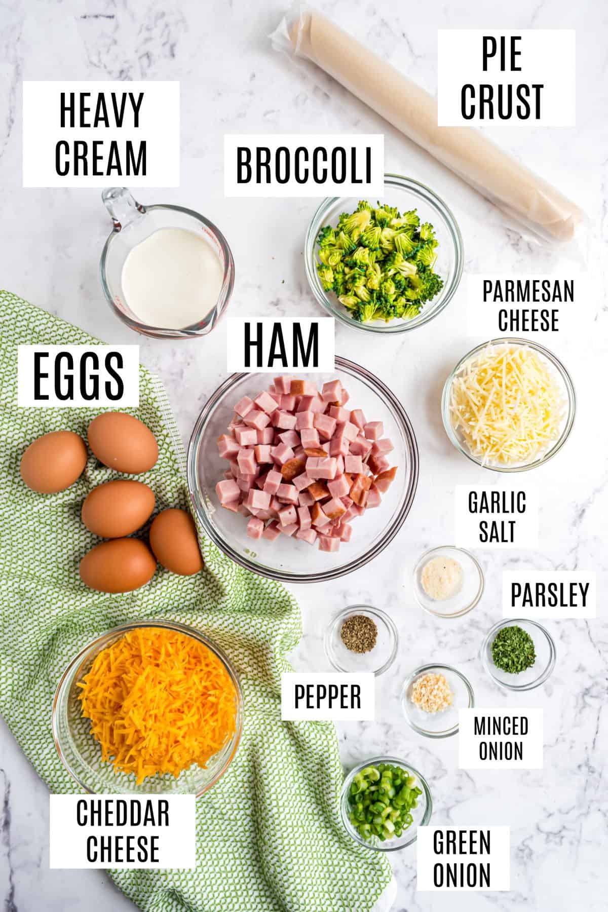 Ingredients needed to make a ham and cheese quiche.