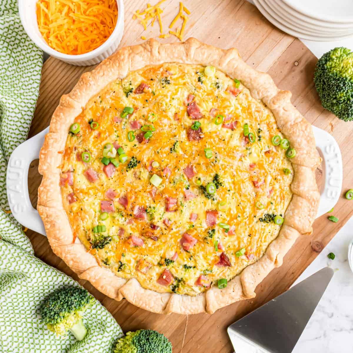 Ham and cheese quiche baked in a pie plate.