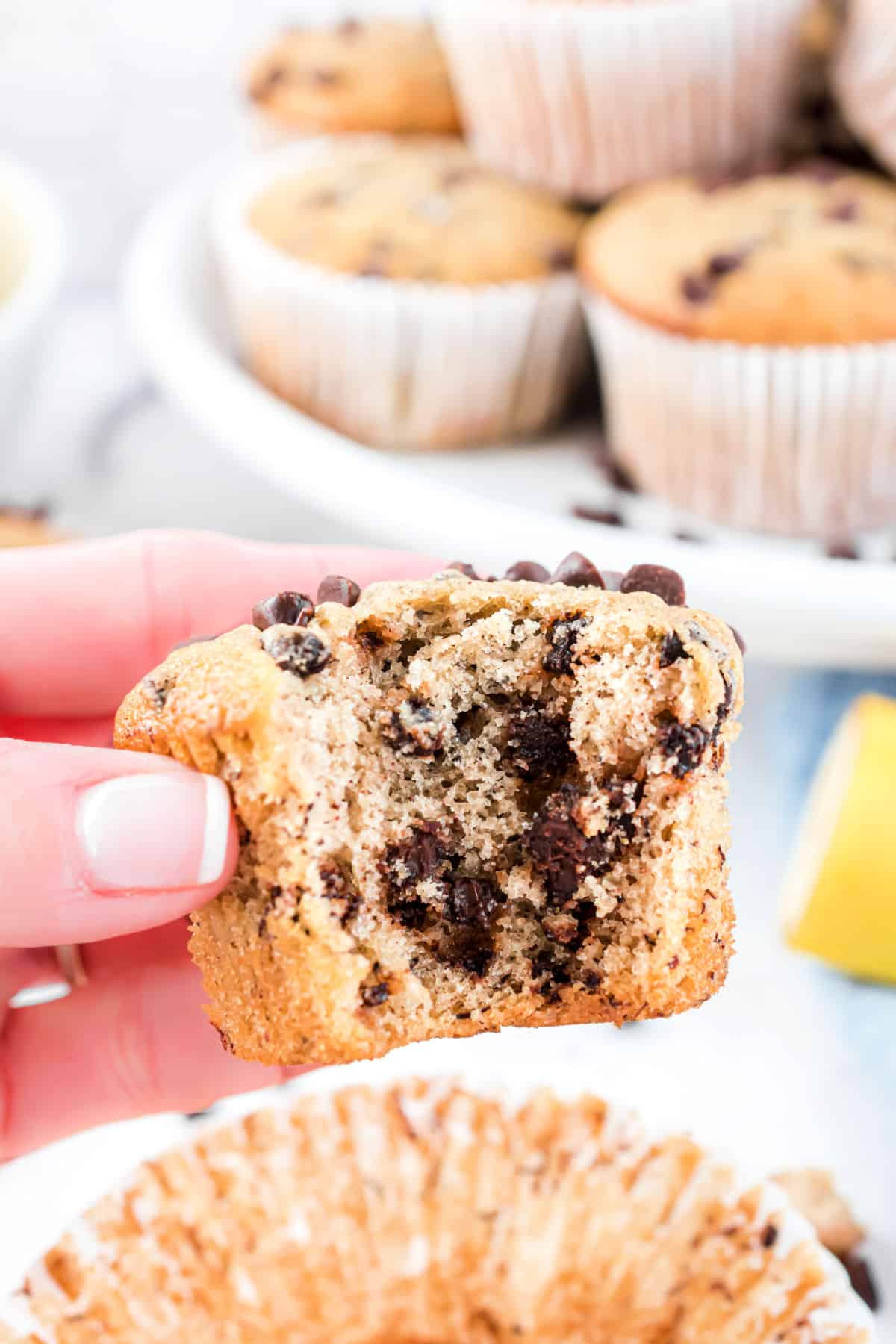 Banana chocolate chip muffins with a bite taken out.