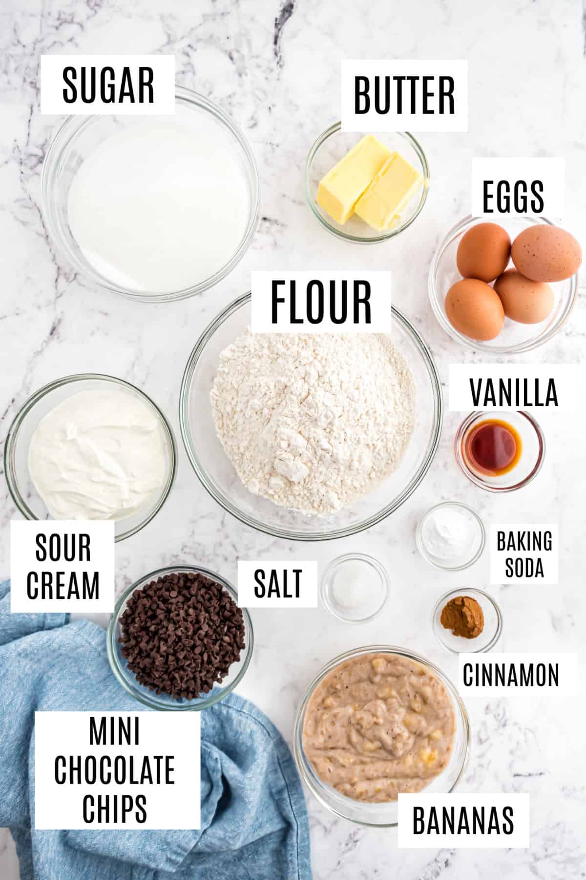 Ingredients needed to make chocolate chip banana muffins.