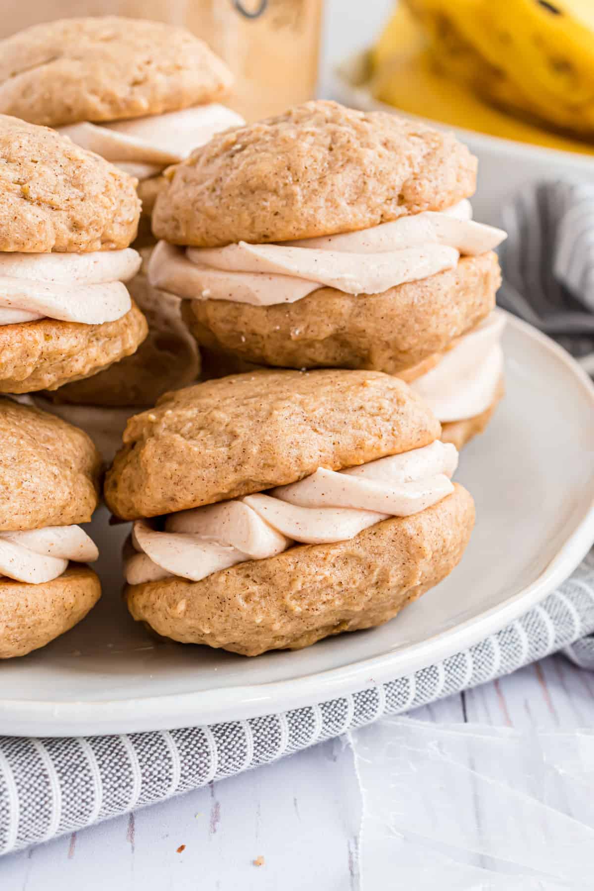 Banana whoopie pies on a white serving platter.