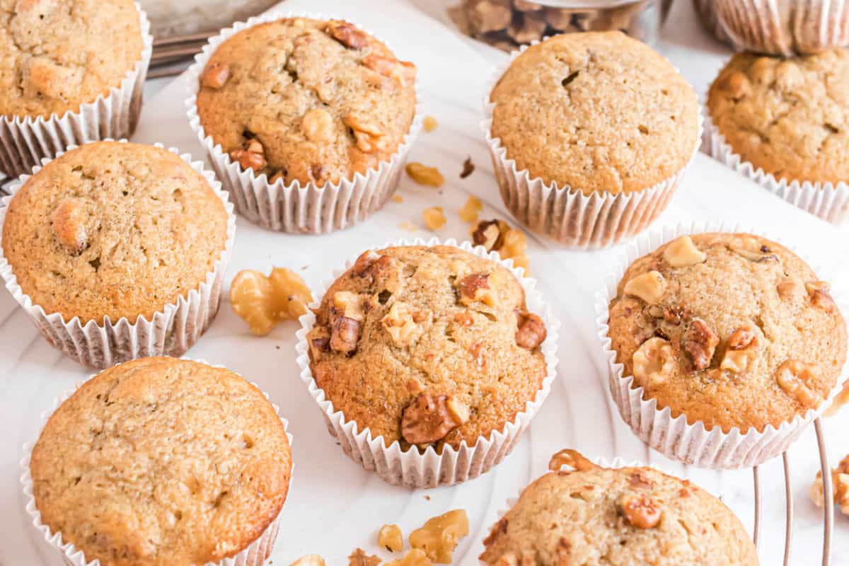 Banana muffins topped with walnuts.