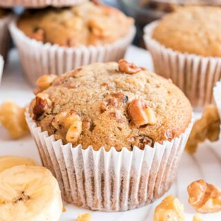 Banana Nut Muffins are easy-to-make breakfast treats with a sweet moist crumb. A hint of cinnamon and crunchy walnuts add the perfect touch to a classic banana muffin.