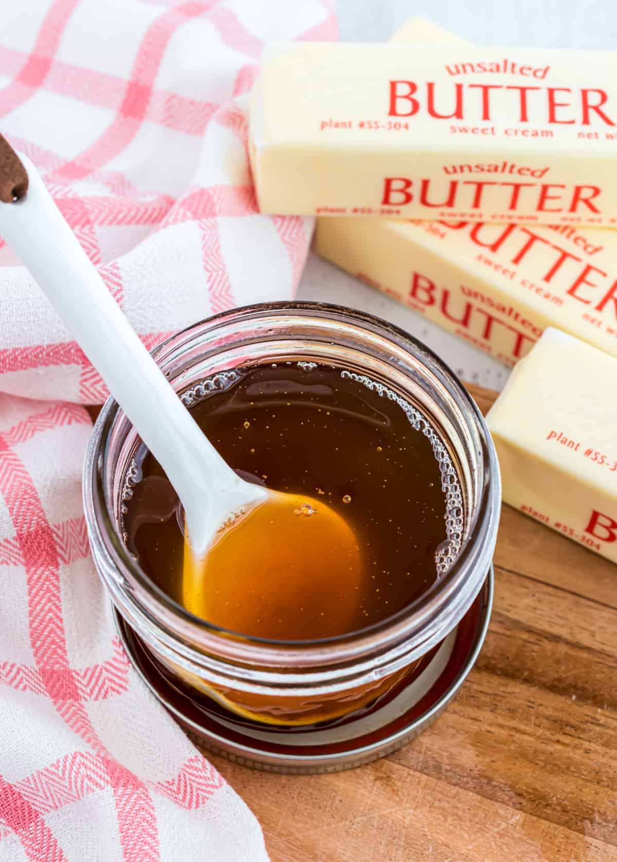 Brown butter in small mason jar.