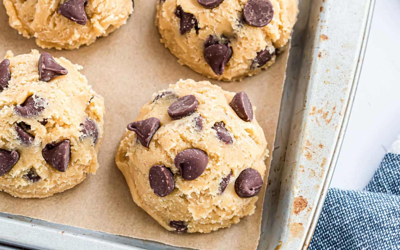 Frozen cookie dough is the perfect hack for busy bakers. Freezing your cookie dough means you can have warm, freshly baked homemade cookies at a moment's notice! Learn the best methods, tips and tricks for freezing cookie dough of all kinds with this simple guide. 