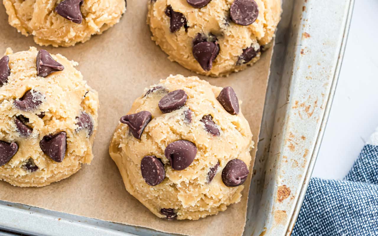 Frozen cookie dough is the perfect hack for busy bakers. Freezing your cookie dough means you can have warm, freshly baked homemade cookies at a moment's notice! Learn the best methods, tips and tricks for freezing cookie dough of all kinds with this simple guide.
