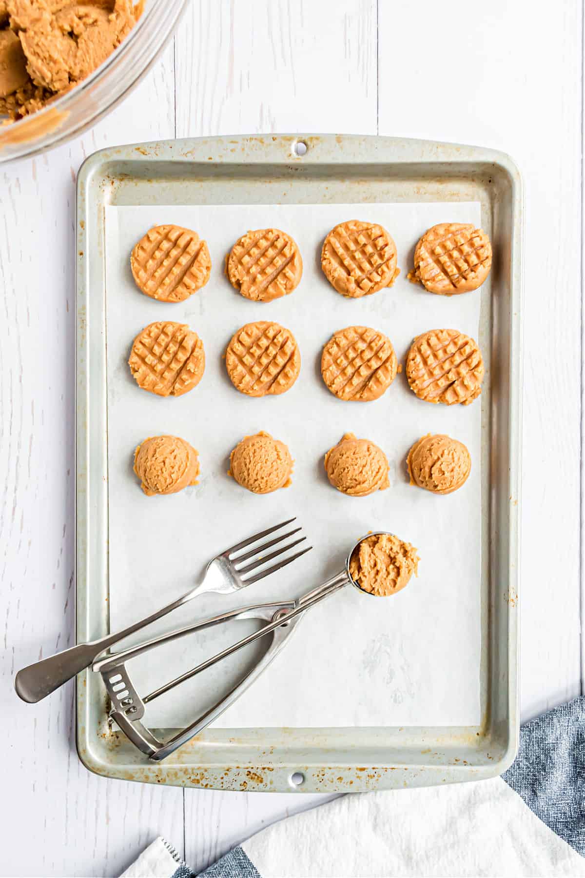 Peanut butter cookie dough on baking sheet for freezing.