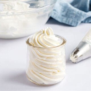 Homemade stabilized whipped cream works just like Cool Whip in all your favorite recipes. Learn how to make a perfect fluffy whipped topping that holds its shape with this step-by-step guide.