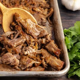 This Instant Pot Carnitas recipe makes flavorful pulled pork with Mexican spices. Ready in one hour, these carnitas are just as juicy and tender as the slow cooked version--with a fraction of the cooking time!