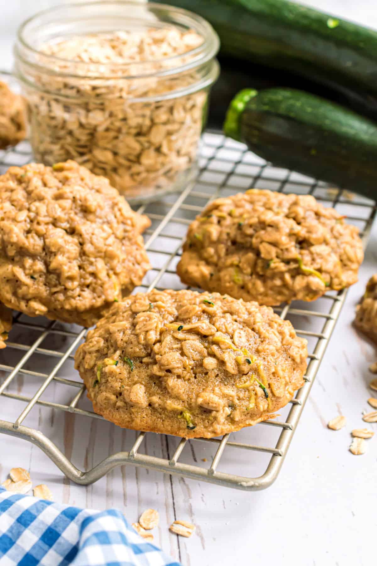 Unfrosted zucchini cookies on cooling rack.