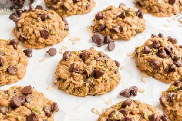 Turn your garden harvest into cookies! These Chocolate Chip Zucchini Cookies are perfectly chewy, with oats and a hint of fall spices. With plenty of semi-sweet morsels, this recipe can turn anyone into a zucchini fan.