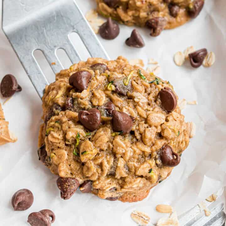 Turn your garden harvest into cookies! These Chocolate Chip Zucchini Cookies are perfectly chewy, with oats and a hint of fall spices. With plenty of semi-sweet morsels, this recipe can turn anyone into a zucchini fan.