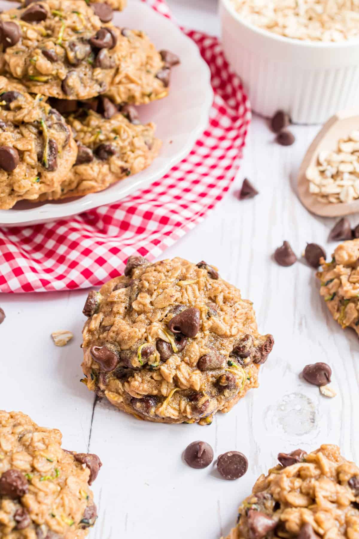 Oatmeal chocolate chip zucchini cookies on wooden table.