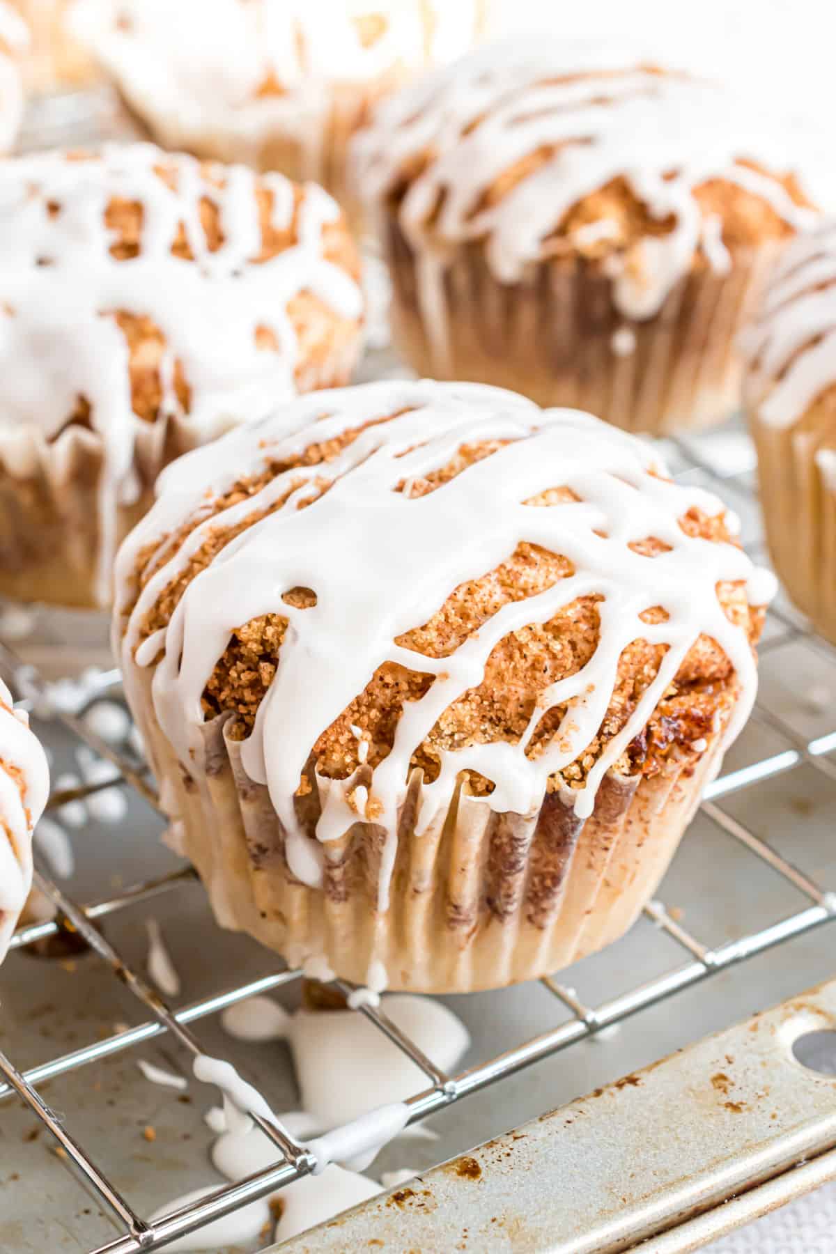 Vanilla glaze on apple cinnamon muffins.