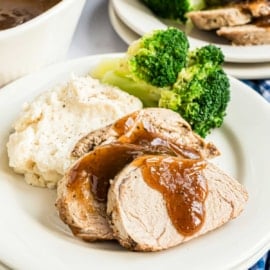 Tender sliced Instant Pot Pork Tenderloin with a balsamic gravy. You'll love this easy weeknight dinner recipe!