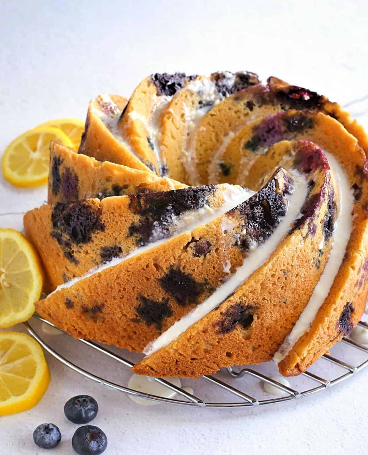 Lemon blueberry bundt cake on a wire rack.