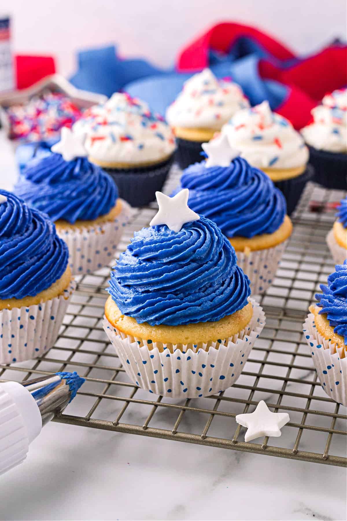 White cupcakes with blue frosting for 4th of July.