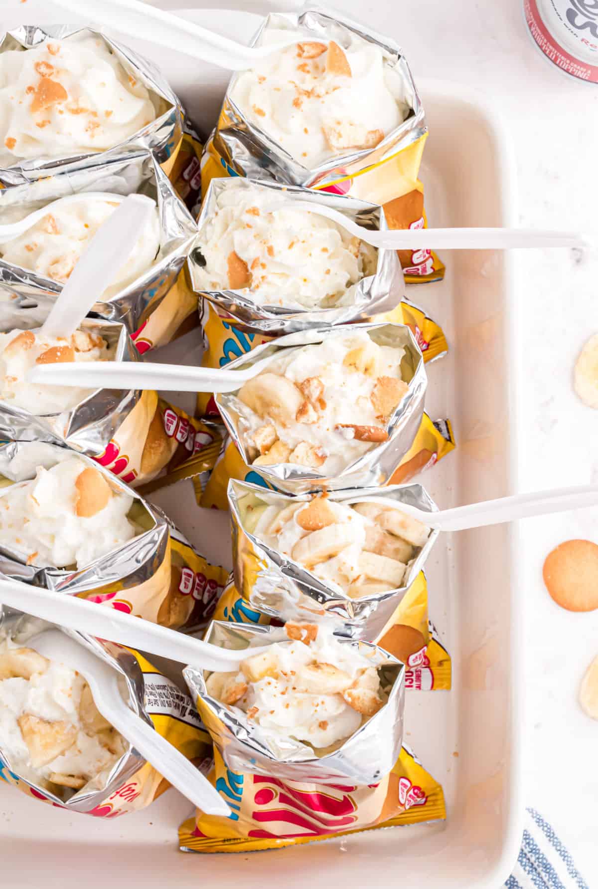 Banana pudding walking desserts assembled with plastic spoons.