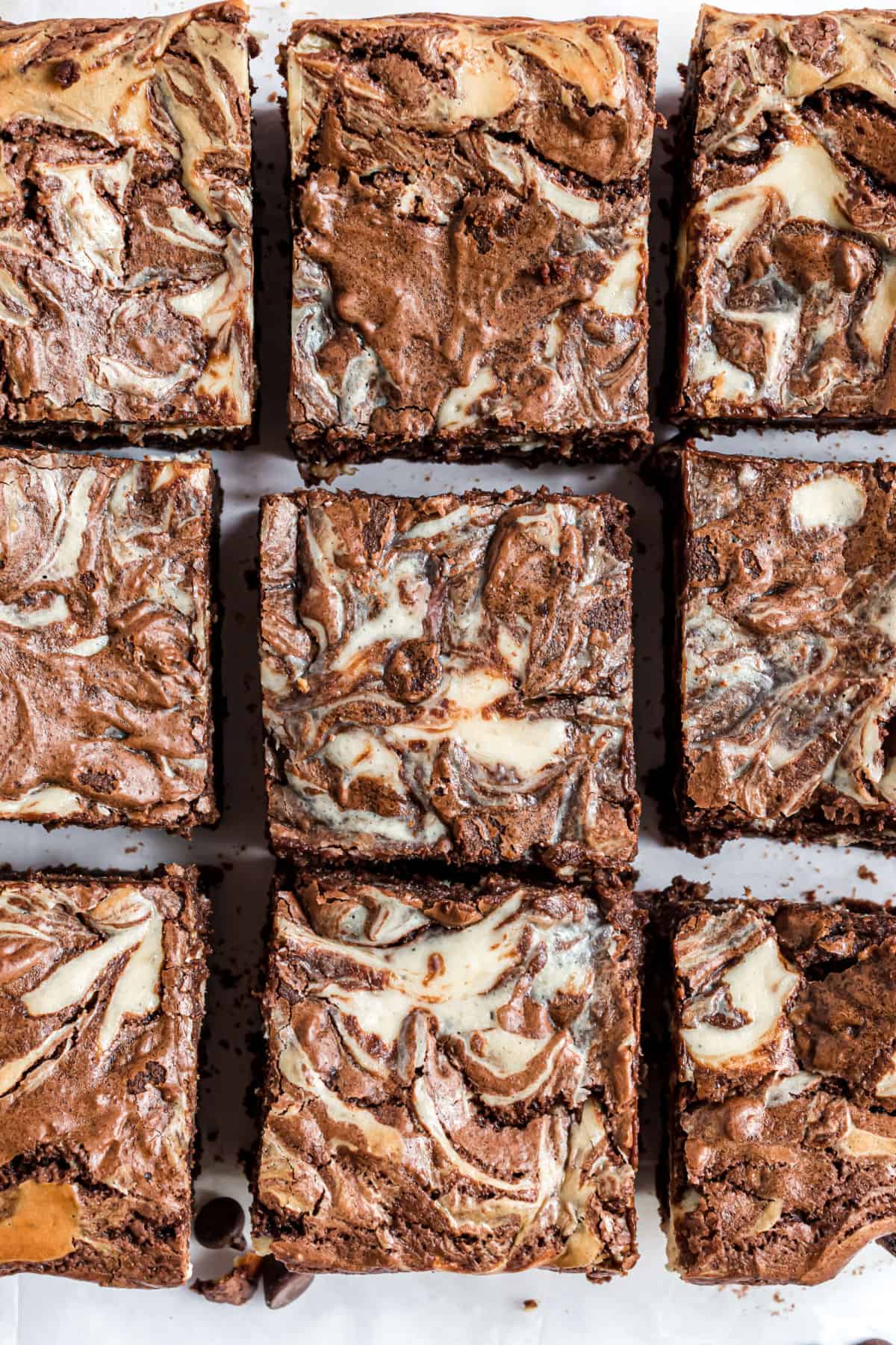 Cream cheese swirled brownies cut into squares.