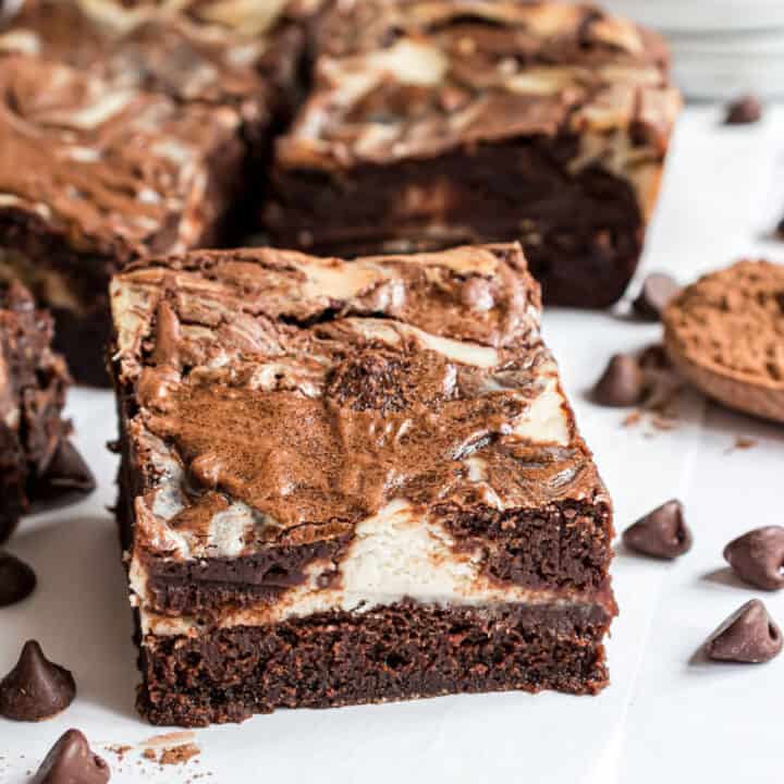 When you can't decide between cheesecake and brownies: make both! Fudgy chocolate brownies are topped with a sweet cream cheese layer in this easy recipe for Cheesecake Brownies.
