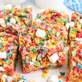Fruity Pebble Rice Krispie Treats are no bake dessert bars with only 4-ingredients. Easy to make and fun to eat, these gooey treats are a hit with the whole family!