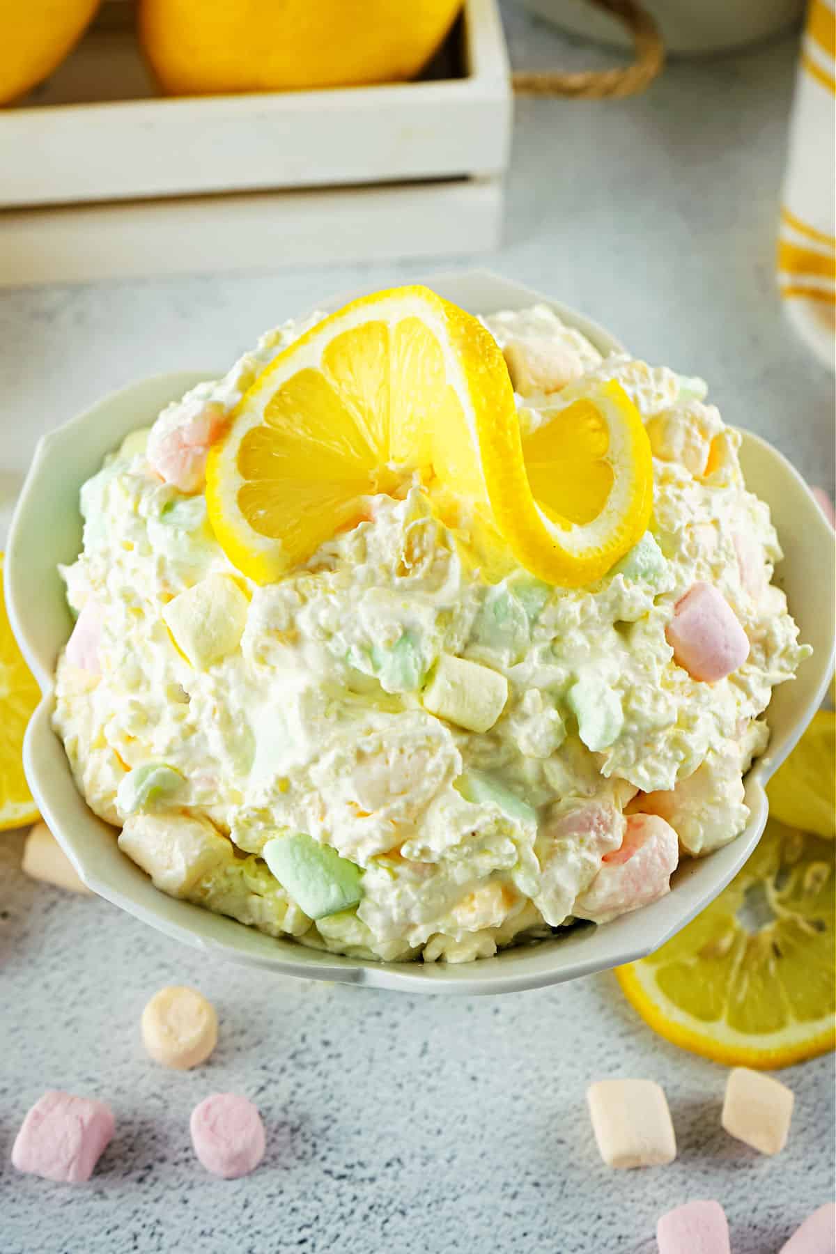 Lemon fluff salad in a white serving bowl.