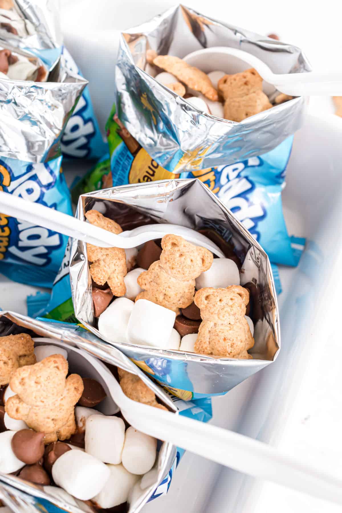 S'mores walking dessert served with plastic spoons.