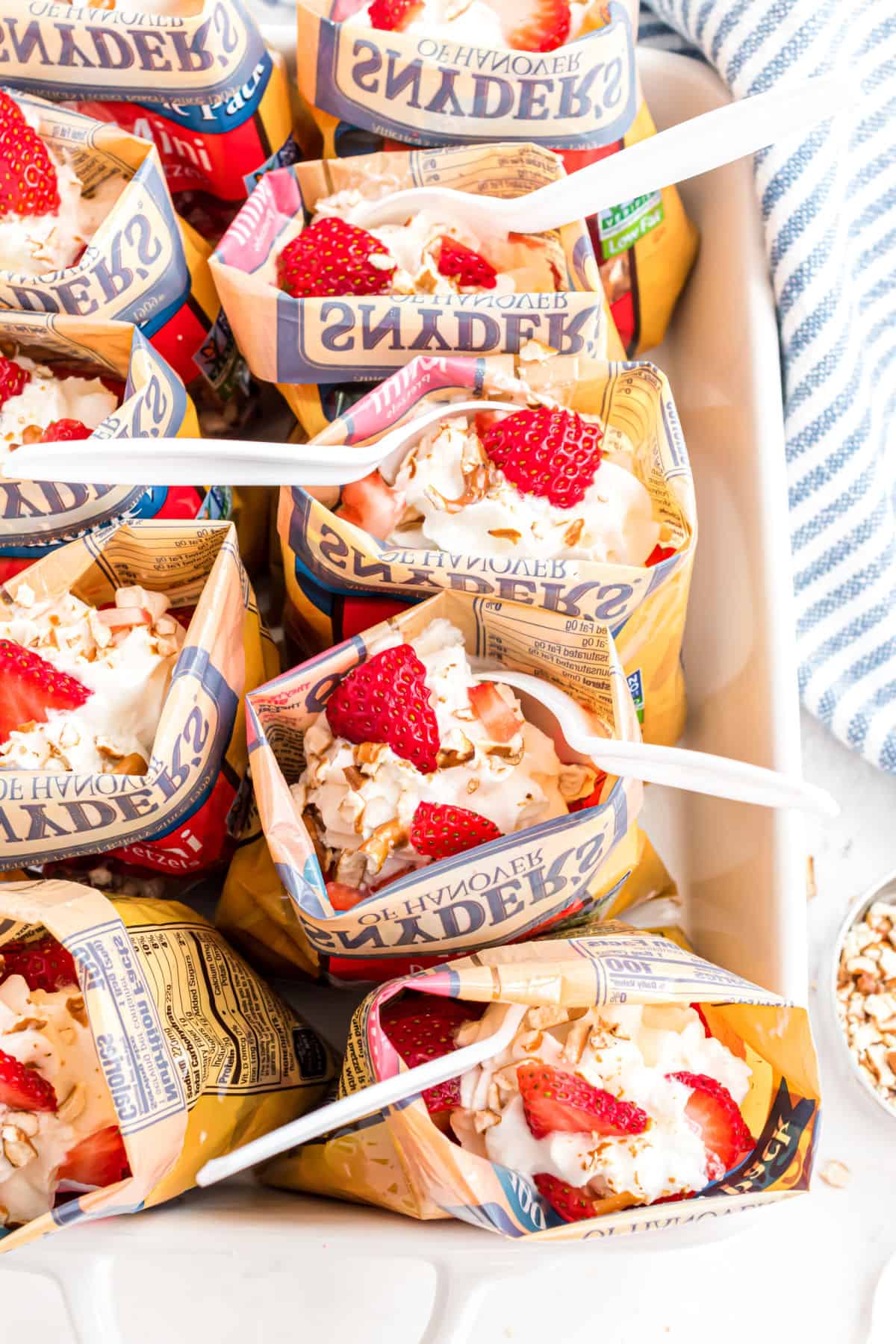 Strawberry pretzel jello served in individual walking bags.