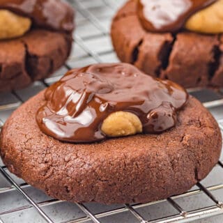 Buckeye Brownie Cookies are the perfect chocolate peanut butter treat! Fudgy chocolate cookies are topped with homemade buckeye candies in this easy recipe.