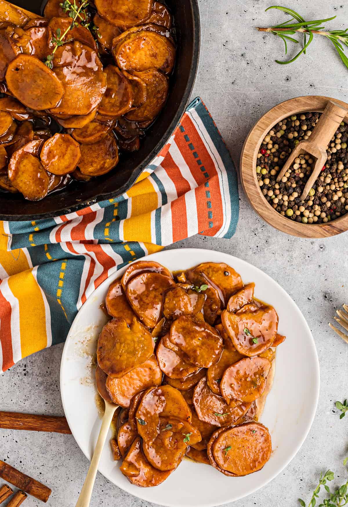 Candied sweet potatoes served on a white plate.