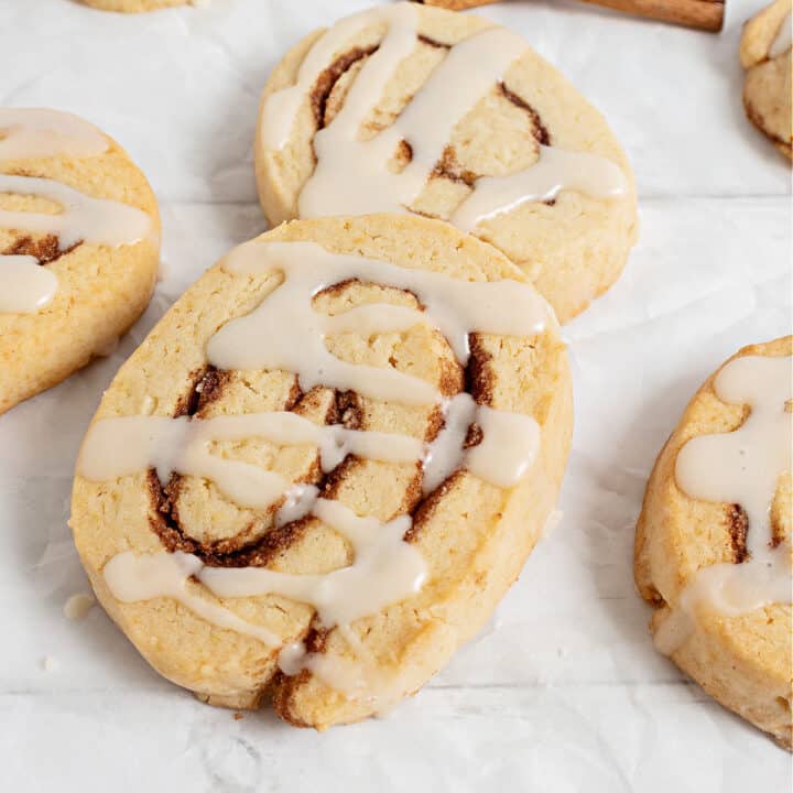 Cinnamon Roll Cookies turn the cinnamon sugar goodness of the gooey breakfast treat into easy-to-eat dessert! Drizzled with sweet cream cheese icing, these cinnamon cookies are an instant new favorite.